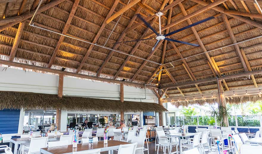 HVLS fan above an outdoor dining area.