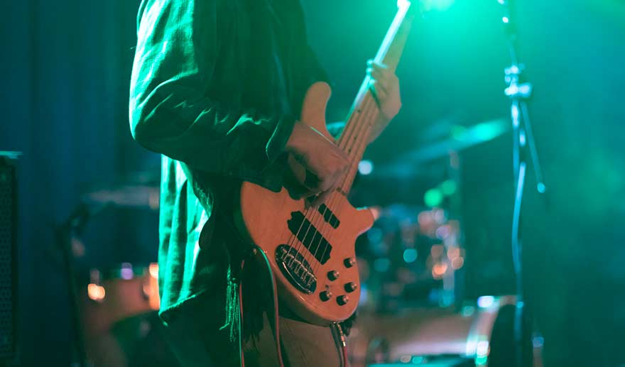 Guitarist playing for an audience.