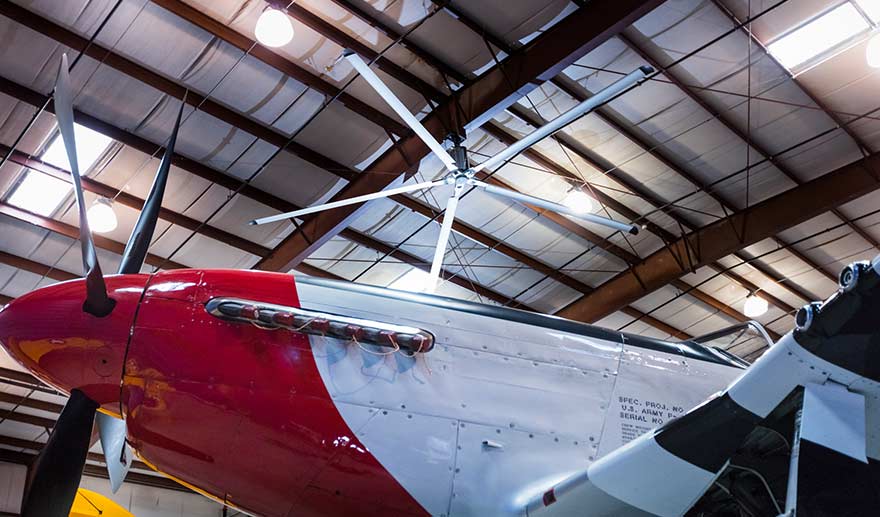 HVLS fan above a small engine aircraft.