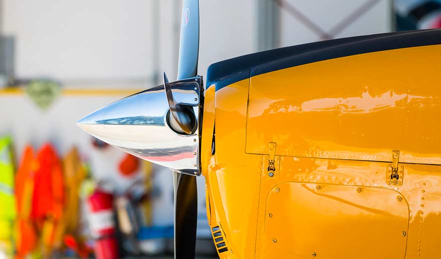 Yellow small engine aircraft.